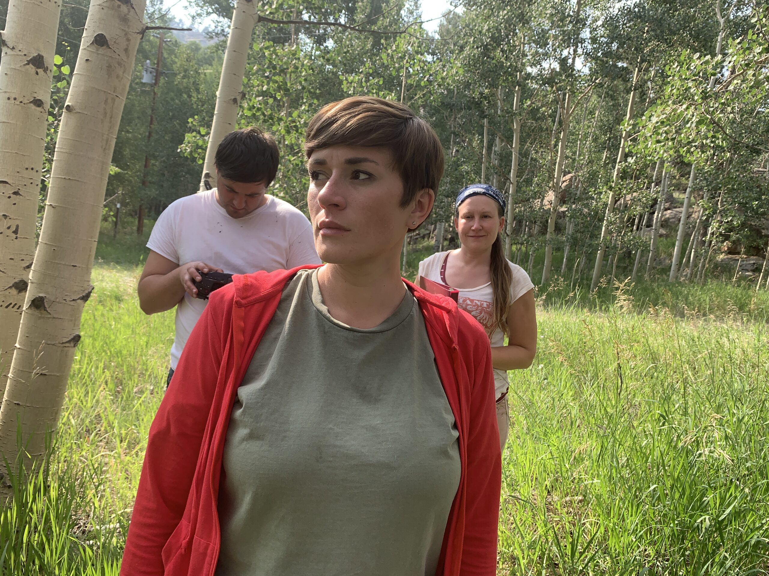 IMG_5433 Photo: Outdoors, a woman walks while a cinematographer and director follow behind.